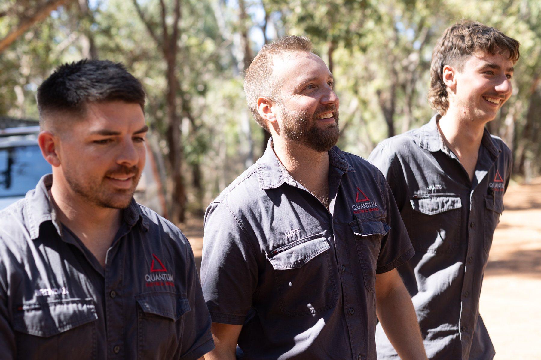 Three Quantum electricians walking to a job together
