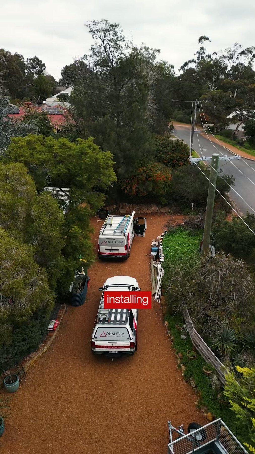 Aerial view of a Quantum van parked on a tree-lined Perth Hills driveway