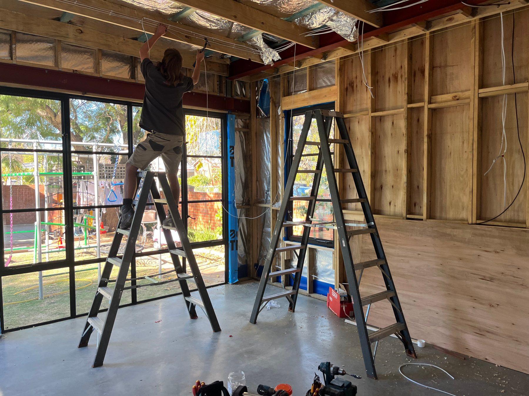 Home renovation in progress with new electrical rough-in through the frame