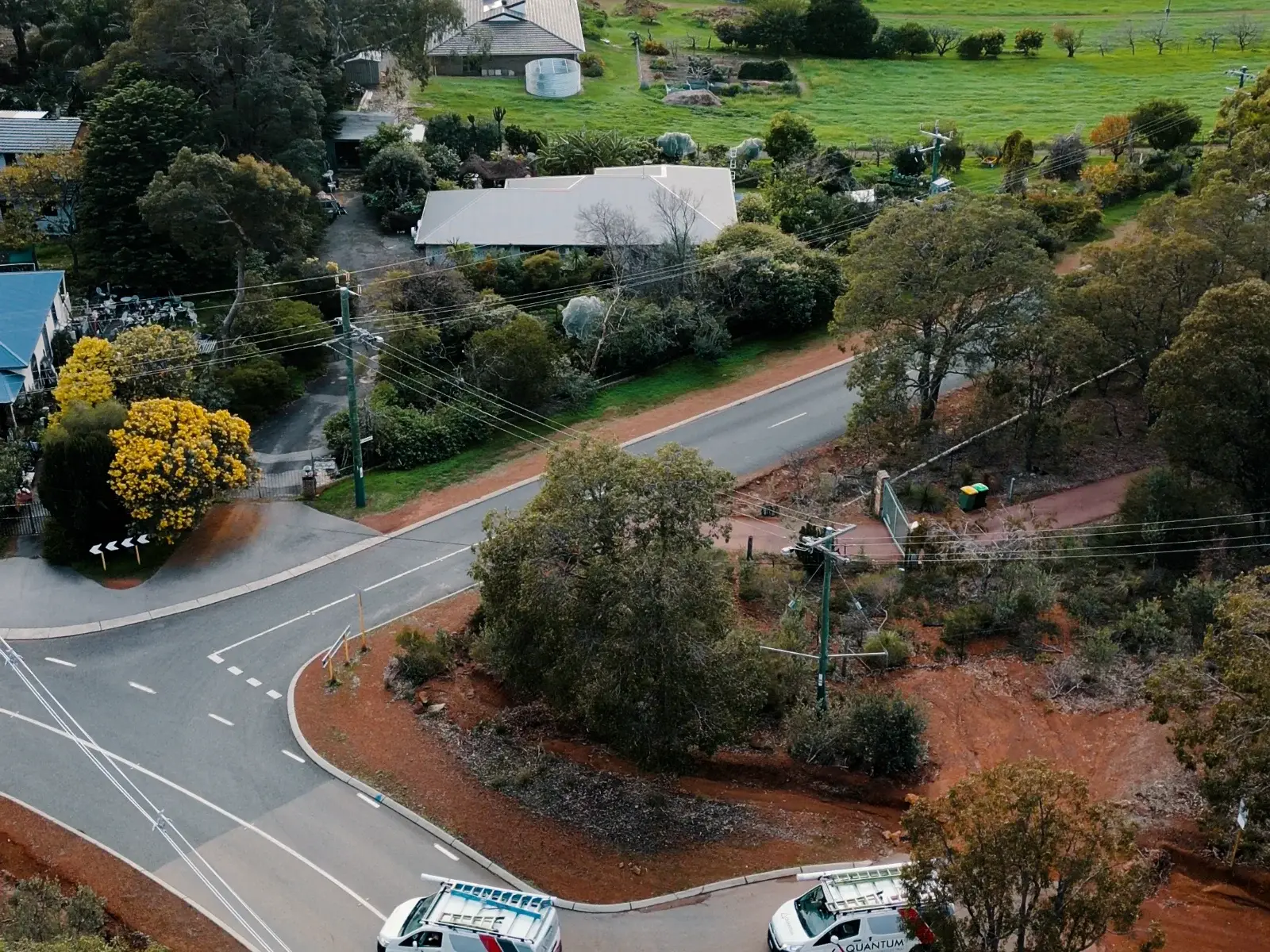 Quantum Electrical team members standing together in Perth Hills bushland